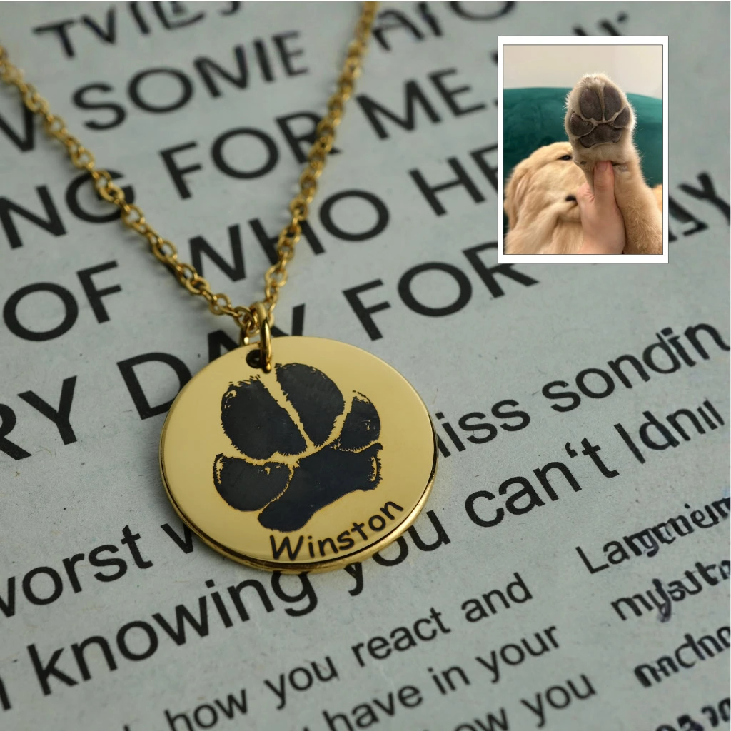 Dog paw engraved necklace on model